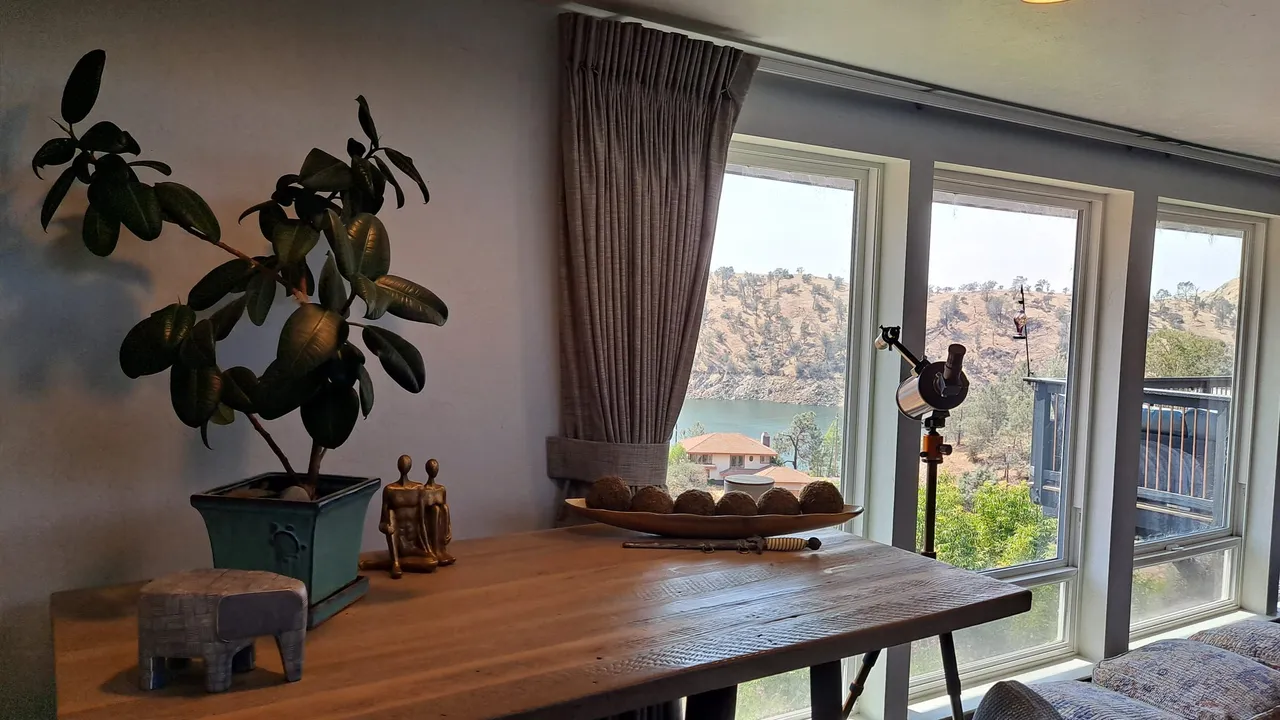A table by the window at the residence