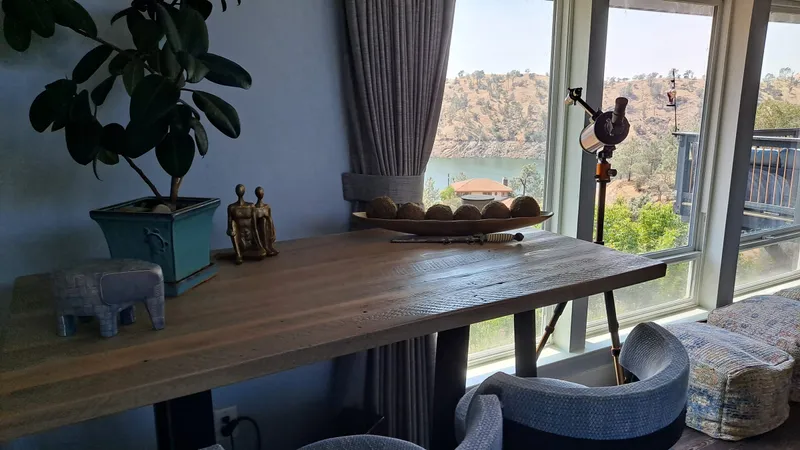The dining table by the window at the residence
